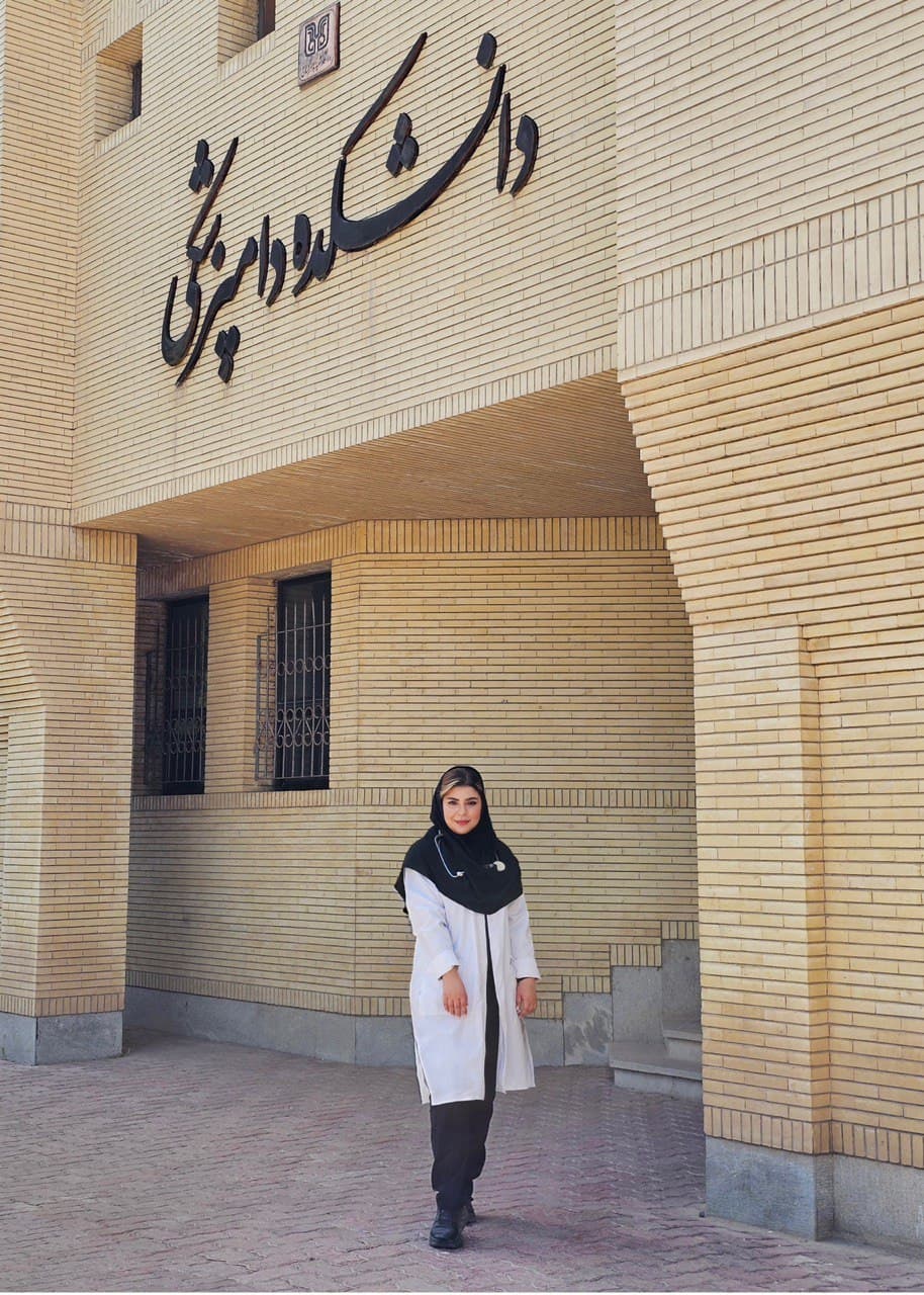 Dr. Ahmadi in front of the Vetrinary College building.